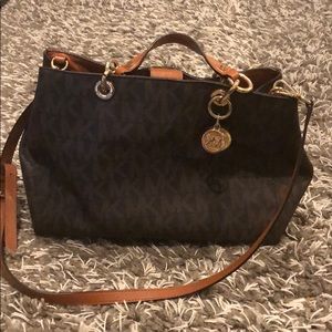 Michael Kors purse with leather removable strap.